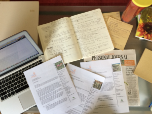 Hot mess desk, complete with tipsheets, notes, and WSJ article on broccoli rabe