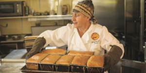 Co-author Jenny Bardwell with fresh SRB loaves at Rising Creek Bakery
